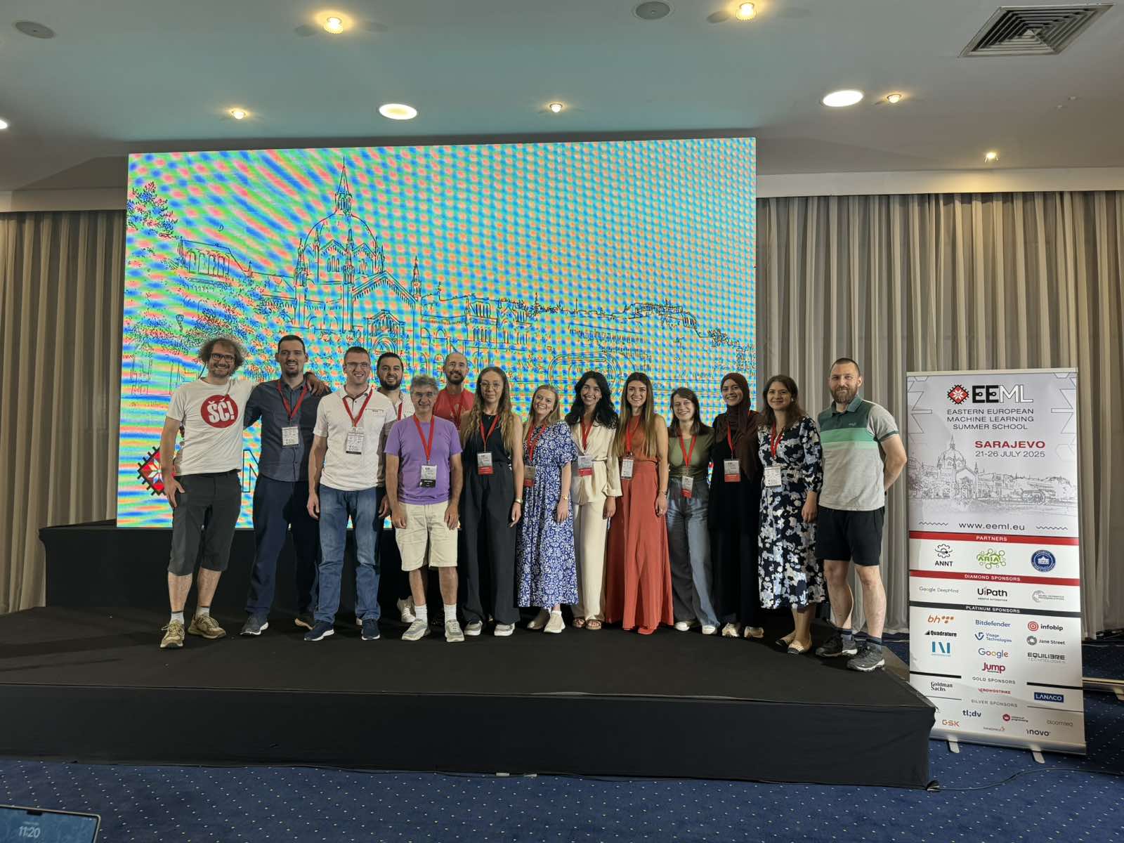 The (almost) full team of EEML 2025 organizers and volunteers smiling together.